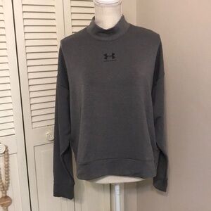 Women’s Under Armour long sleeve top. New without tags size large.